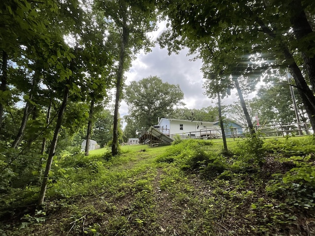 779 Dogwood Dr, Erin, TN 37061 - view of yard with stairway and a deck