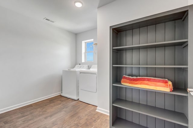 4112 Cadence Dr, Spring Hill, TN 37174 - laundry area featuring wood finished floors and independent washer and dryer