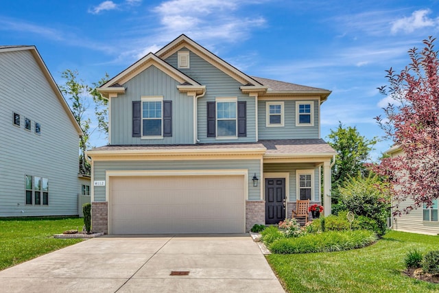 4112 Cadence Dr, Spring Hill, TN 37174 - craftsman-style home featuring a garage, concrete driveway, board and batten siding, and a front lawn