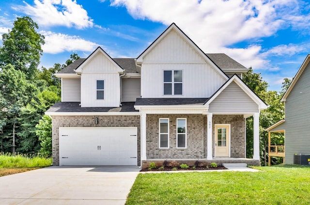 582 Pongracz Way, Clarksville, TN 37042 - view of front of house with brick siding, driveway, covered porch, a front lawn, and a garage