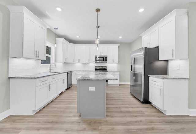 582 Pongracz Way, Clarksville, TN 37042 - kitchen with stainless steel appliances, white cabinets, tasteful backsplash, and recessed lighting