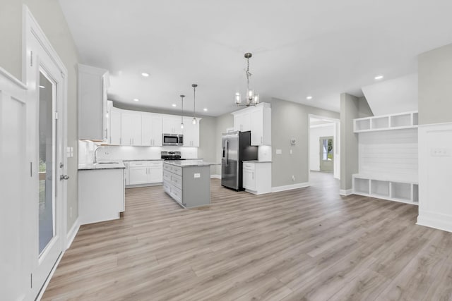 582 Pongracz Way, Clarksville, TN 37042 - kitchen featuring stainless steel appliances, light wood-style floors, a center island, recessed lighting, and white cabinets
