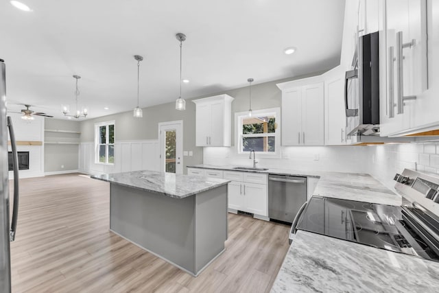 582 Pongracz Way, Clarksville, TN 37042 - kitchen featuring appliances with stainless steel finishes, ceiling fan, white cabinets, recessed lighting, and plenty of natural light