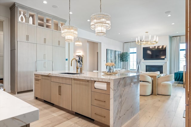 8227 Heirloom Blvd, College Grove, TN 37046 - kitchen with a chandelier, open floor plan, light wood-type flooring, light brown cabinets, and recessed lighting