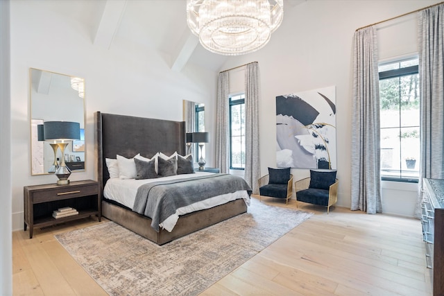 8227 Heirloom Blvd, College Grove, TN 37046 - bedroom featuring a chandelier, wood finished floors, beam ceiling, multiple windows, and high vaulted ceiling
