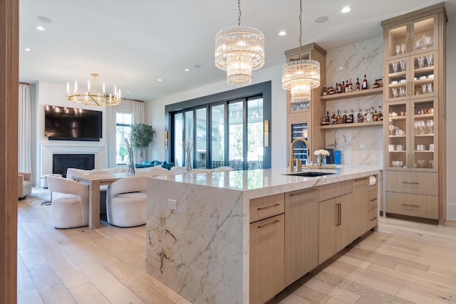 8227 Heirloom Blvd, College Grove, TN 37046 - kitchen with a chandelier, open floor plan, light wood finished floors, a spacious island, and recessed lighting