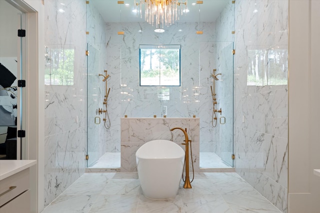 8227 Heirloom Blvd, College Grove, TN 37046 - bathroom with a marble finish shower, a freestanding tub, marble tiled flooring, a chandelier, and tile walls