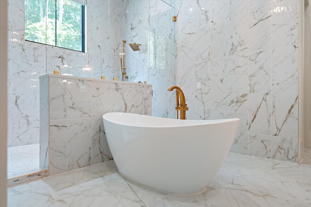 8227 Heirloom Blvd, College Grove, TN 37046 - full bath featuring marble tiled floors, tile walls, a soaking tub, a marble finish shower, and stone wall