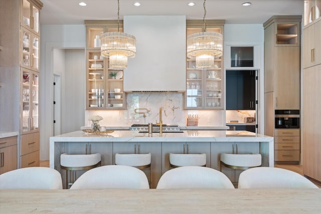 8227 Heirloom Blvd, College Grove, TN 37046 - kitchen with a chandelier, a breakfast bar, decorative backsplash, and recessed lighting