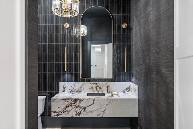 8227 Heirloom Blvd, College Grove, TN 37046 - bathroom with a chandelier, tile walls, and vanity