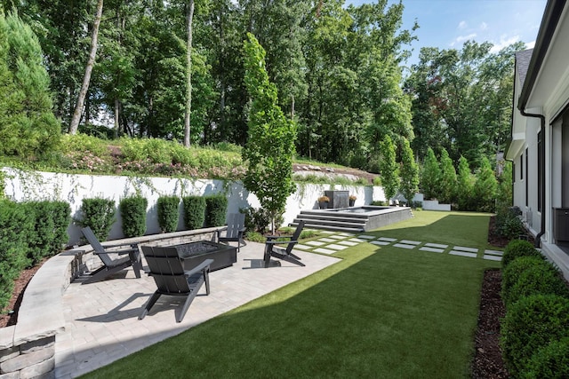 8227 Heirloom Blvd, College Grove, TN 37046 - view of green lawn with a fire pit and a patio area