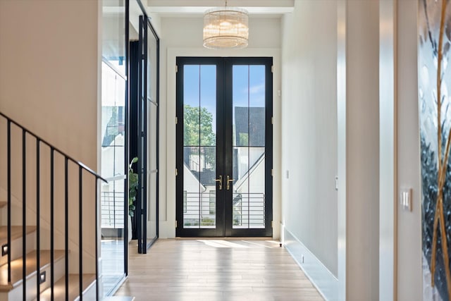 8227 Heirloom Blvd, College Grove, TN 37046 - foyer entrance featuring french doors, wood finished floors, a chandelier, and stairway