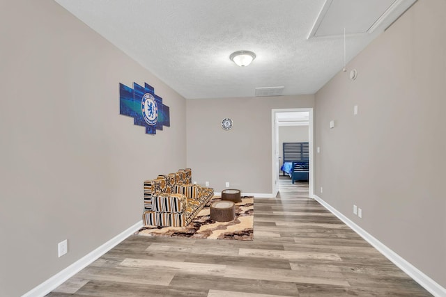 4835 Octavia St, Murfreesboro, TN 37129 - sitting room with attic access, wood finished floors, and a textured ceiling