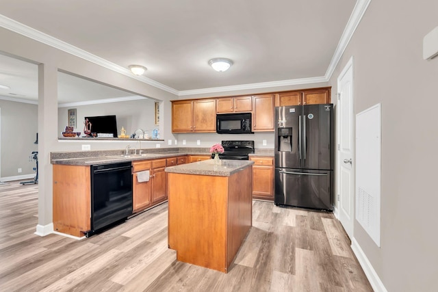 4835 Octavia St, Murfreesboro, TN 37129 - kitchen featuring black appliances, light wood-type flooring, crown molding, a center island, and brown cabinets