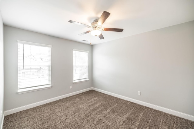 2075 Downstream Dr, Ashland City, TN 37015 - spare room featuring a ceiling fan and dark colored carpet