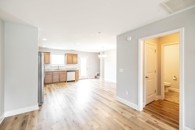 2075 Downstream Dr, Ashland City, TN 37015 - unfurnished living room featuring light wood finished floors, a chandelier, and recessed lighting