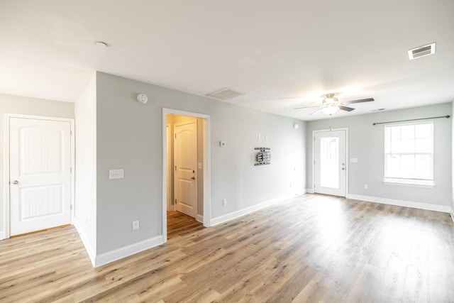 2075 Downstream Dr, Ashland City, TN 37015 - unfurnished living room with a ceiling fan and light wood-style floors