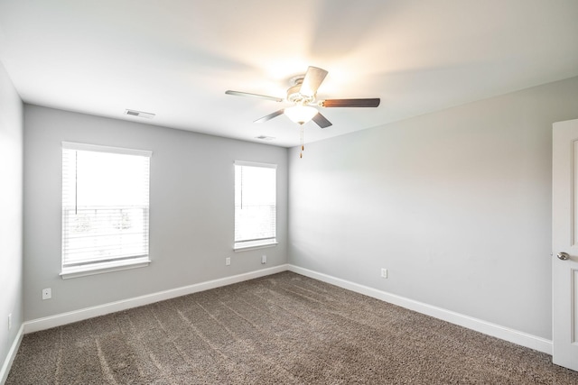 2075 Downstream Dr, Ashland City, TN 37015 - spare room with a ceiling fan and dark carpet