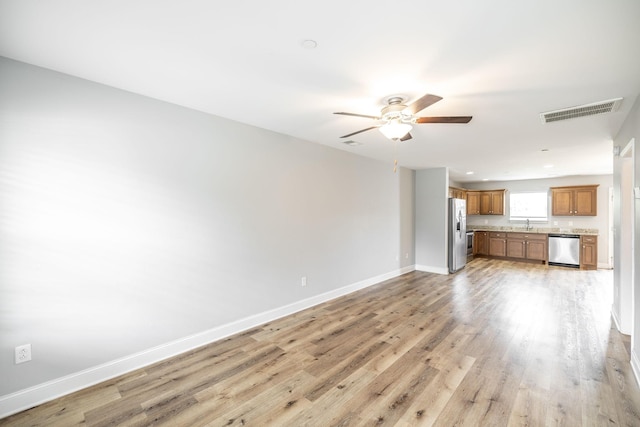 2075 Downstream Dr, Ashland City, TN 37015 - unfurnished living room featuring ceiling fan and light wood finished floors