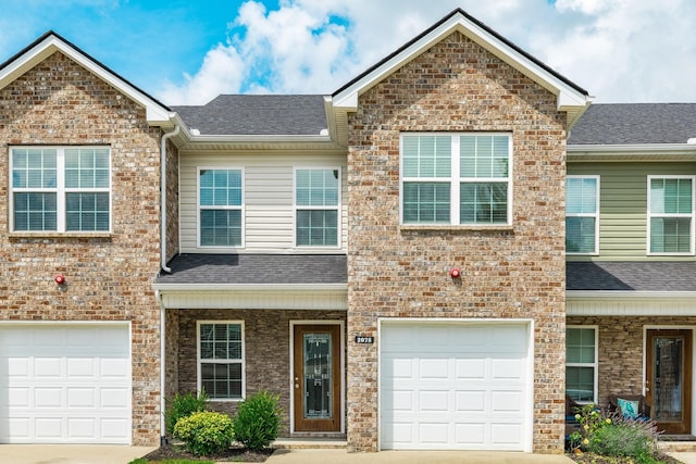 2075 Downstream Dr, Ashland City, TN 37015 - view of front of property with a garage, concrete driveway, and a shingled roof