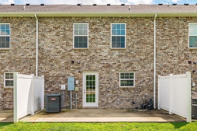 2071 Downstream Dr, Ashland City, TN 37015 - rear view of property with a patio, brick siding, and roof with shingles