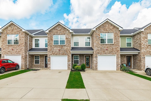 2071 Downstream Dr, Ashland City, TN 37015 - townhome / multi-family property with concrete driveway, a garage, and roof with shingles