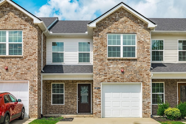 2071 Downstream Dr, Ashland City, TN 37015 - townhome / multi-family property featuring a garage, concrete driveway, and a shingled roof