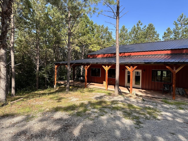 201 Summit Dr, Linden, TN 37096 - view of front of home with board and batten siding and a metal roof
