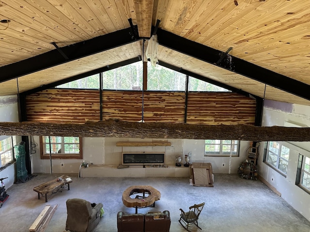 201 Summit Dr, Linden, TN 37096 - unfurnished living room featuring wooden ceiling and a glass covered fireplace