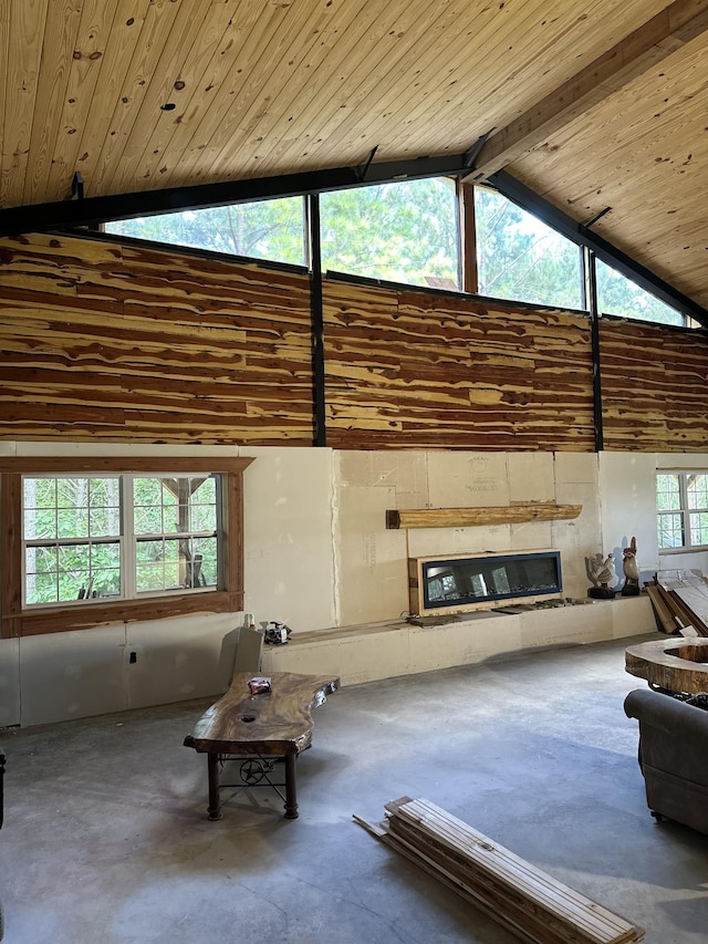 201 Summit Dr, Linden, TN 37096 - living room featuring concrete floors, high vaulted ceiling, a glass covered fireplace, and a wooden ceiling with exposed beams