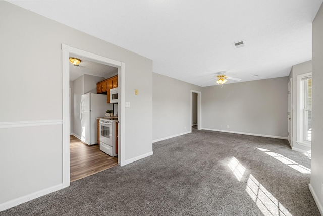 1066 Shadow Ridge Ave, Oak Grove, KY 42262 - unfurnished living room with dark colored carpet and ceiling fan