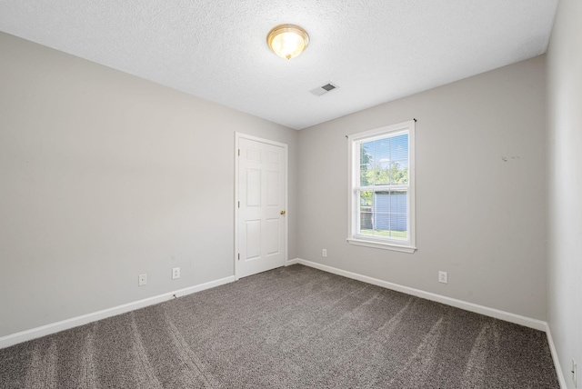 1066 Shadow Ridge Ave, Oak Grove, KY 42262 - unfurnished room featuring dark carpet and a textured ceiling