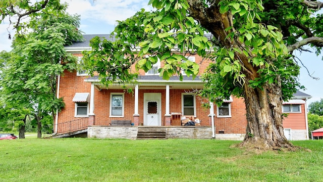 857 Davenport Rd, Cumberland City, TN 37050 - view of front facade with a porch, a front lawn, brick siding, crawl space, and a shingled roof