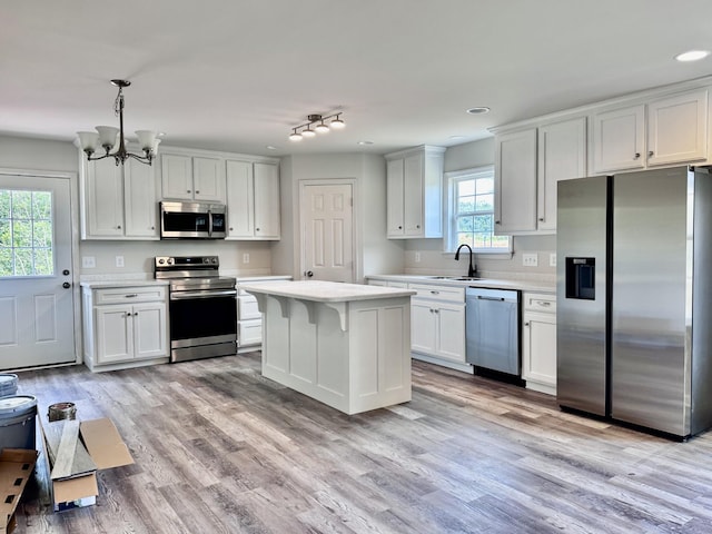 1122 Brannon Rd, Lawrenceburg, TN 38464 - kitchen featuring stainless steel appliances, light countertops, a chandelier, light wood-style flooring, and recessed lighting