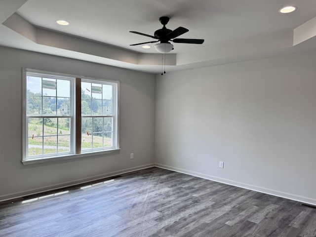 1122 Brannon Rd, Lawrenceburg, TN 38464 - spare room with a raised ceiling, dark wood finished floors, recessed lighting, and ceiling fan
