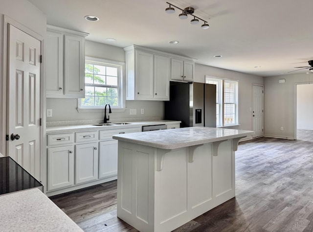1122 Brannon Rd, Lawrenceburg, TN 38464 - kitchen featuring stainless steel fridge with ice dispenser, light countertops, a center island, white cabinets, and recessed lighting