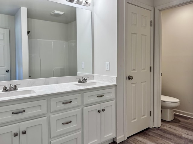 1122 Brannon Rd, Lawrenceburg, TN 38464 - bathroom featuring double vanity, wood finished floors, and a shower