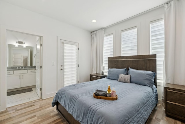1111 Baptist World Center Dr Unit 5, Nashville, TN 37207 - bedroom with light wood-style floors, ensuite bathroom, and recessed lighting