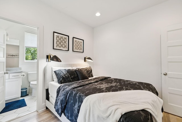 1111 Baptist World Center Dr Unit 5, Nashville, TN 37207 - bedroom with connected bathroom, recessed lighting, and light wood finished floors