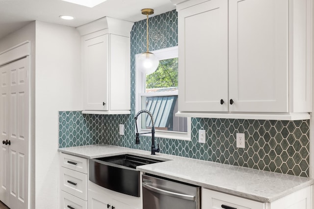 8205 Brownstone Ext, Cross Plains, TN 37049 - kitchen featuring dishwasher, white cabinetry, light stone counters, pendant lighting, and backsplash