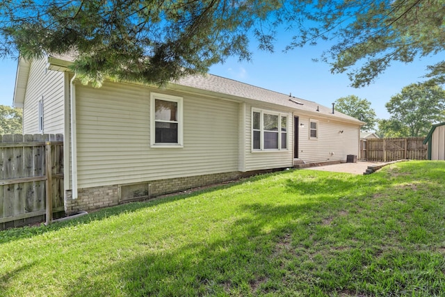 8205 Brownstone Ext, Cross Plains, TN 37049 - back of property featuring a patio area and a fenced backyard