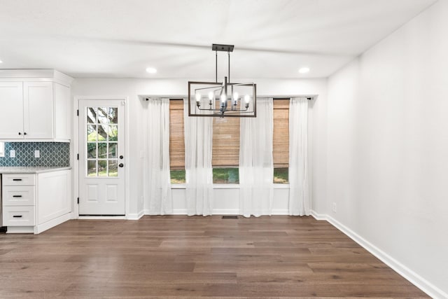 8205 Brownstone Ext, Cross Plains, TN 37049 - unfurnished dining area featuring a chandelier, dark wood-style floors, and recessed lighting