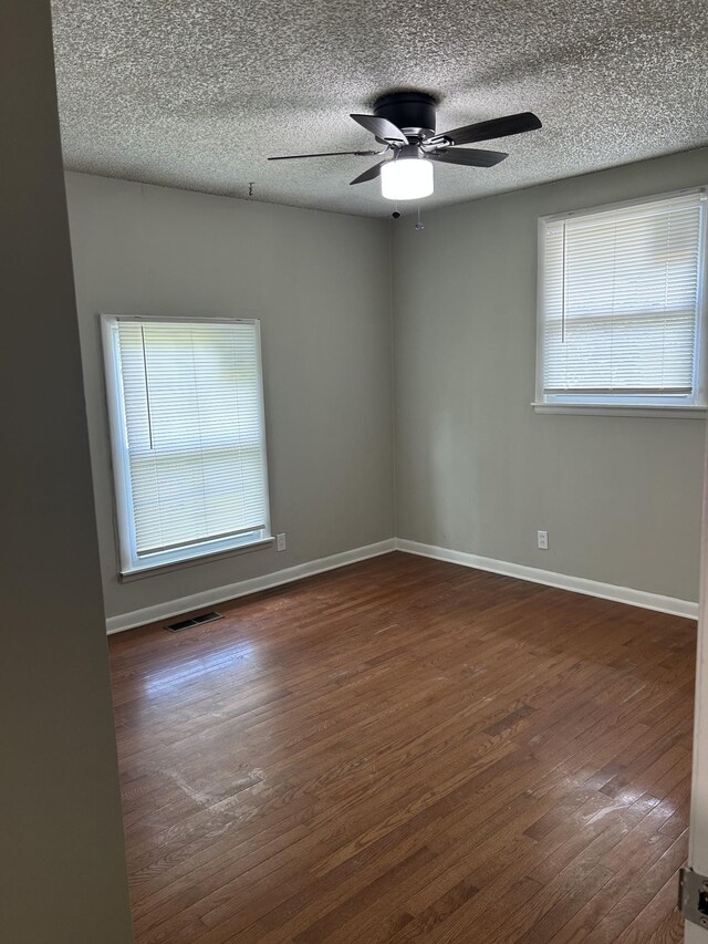 716 Muskhogean Ct, Antioch, TN 37013 - empty room with wood finished floors, ceiling fan, and a textured ceiling
