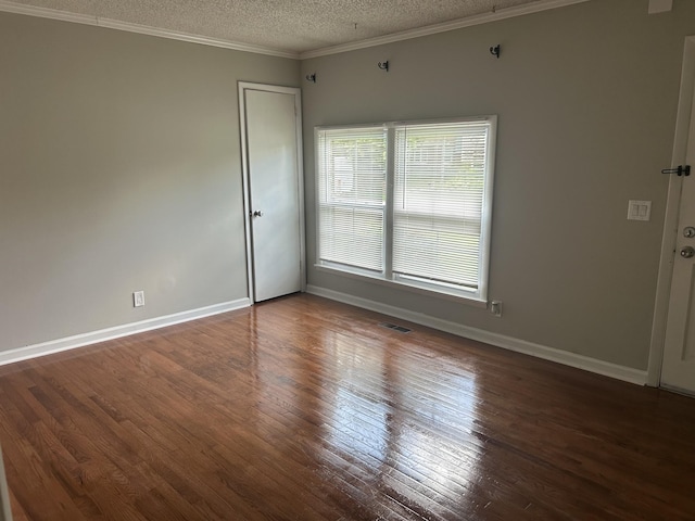716 Muskhogean Ct, Antioch, TN 37013 - empty room featuring a textured ceiling, hardwood / wood-style flooring, and crown molding