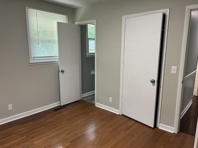 716 Muskhogean Ct, Antioch, TN 37013 - unfurnished bedroom with wood finished floors and baseboards
