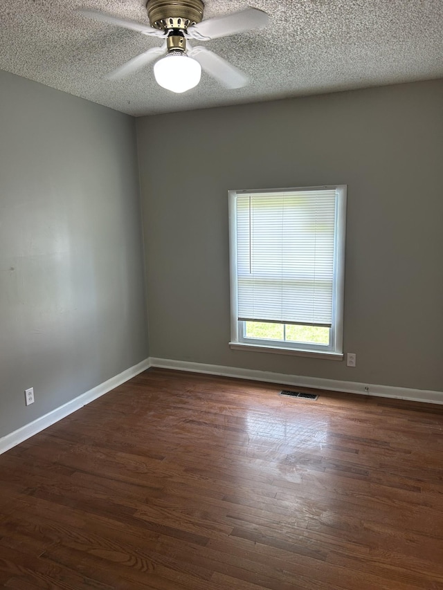 716 Muskhogean Ct, Antioch, TN 37013 - unfurnished room with a textured ceiling, a ceiling fan, and dark wood-style floors