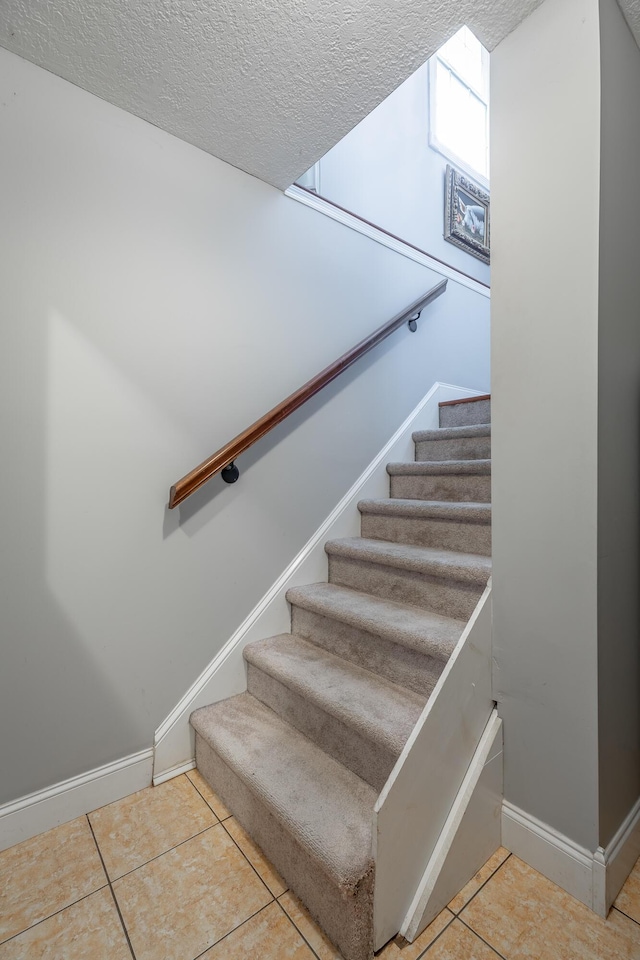 78 Gray Rd, Signal Mountain, TN 37377 - stairs with tile patterned floors and a textured ceiling