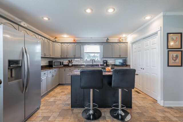 78 Gray Rd, Signal Mountain, TN 37377 - kitchen featuring appliances with stainless steel finishes, gray cabinets, crown molding, tasteful backsplash, and recessed lighting