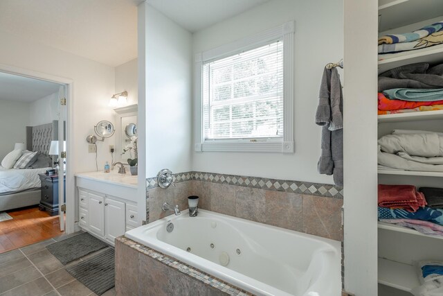 78 Gray Rd, Signal Mountain, TN 37377 - ensuite bathroom with vanity, a whirlpool tub, and tile patterned flooring