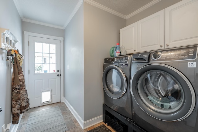 78 Gray Rd, Signal Mountain, TN 37377 - laundry area with independent washer and dryer, cabinet space, ornamental molding, and stone tile flooring
